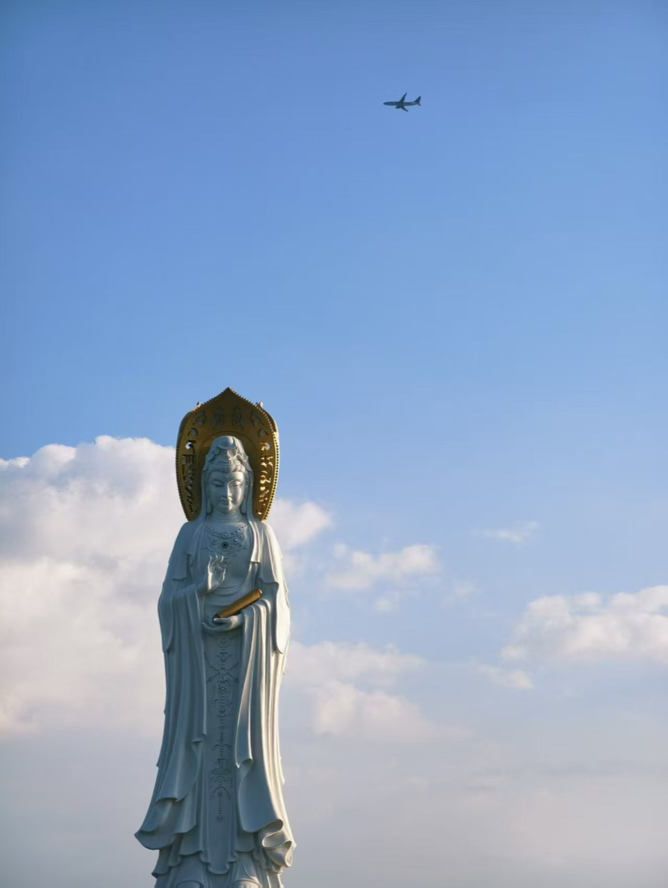 Statue of Guanyin of the South Sea against a blue sky in Sanya
